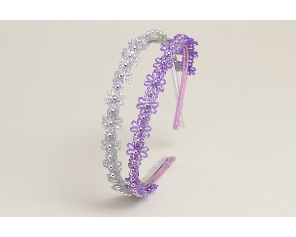 Pack of 2 alice bands with flower & glitter detail. In purple & silver & pink & silver