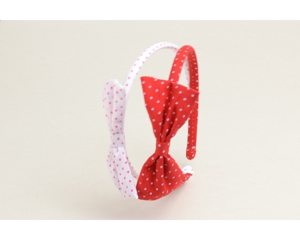 Polka dot fabric alice band with bow detail. In red & white