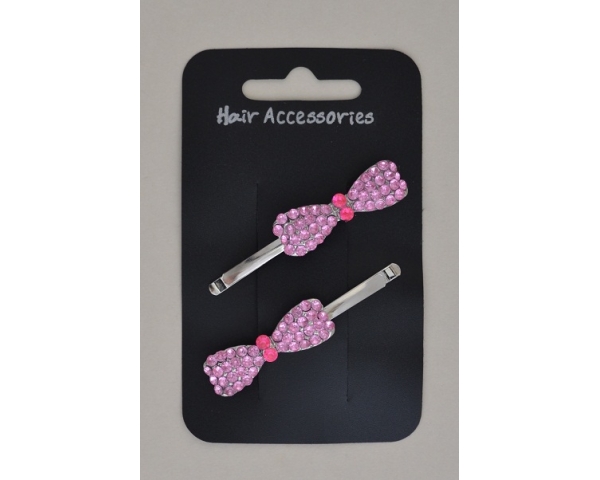 Bow shaped diamante grips. Packed in assorted hot pink, pink, grey & clear diamantes