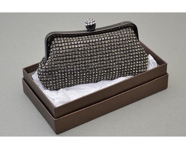 Pewter clutch bag covered in crystal stones with a round clasp encrusted with crystals. Long chain included.