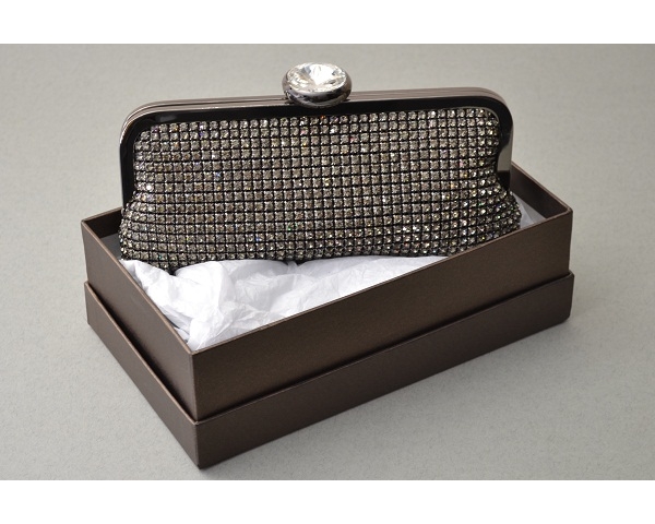 Pewter clutch bag covered in crystals with a large round diamante clasp. Long chain included
