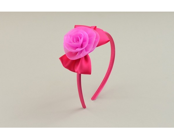 Shimmery flower with sateen bow side mounted on sateen covered alice band in fuchsia pink & white