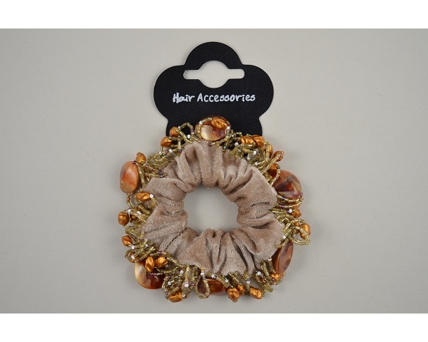 1 velvet scrunchie with beading trim. In black or beige