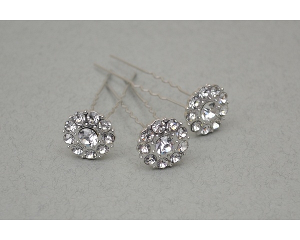 Circular design silver hair pin decorated with crystals. Approx 2cm. Packed 12 pins per container