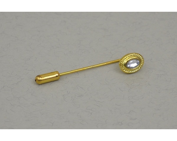 Gold cravat pin with clear gemstone