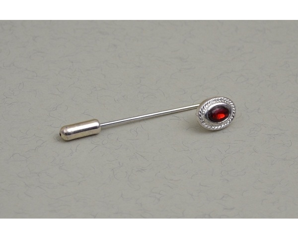 Silver cravat pin with red gemstone