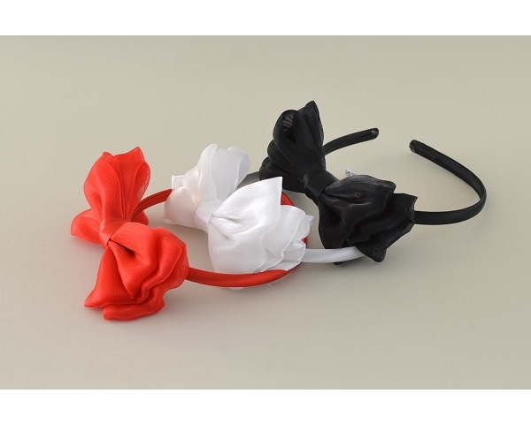 Sateen covered alice band with side mounted sateen bow in a shimmering fabric. Red, white & black per pack