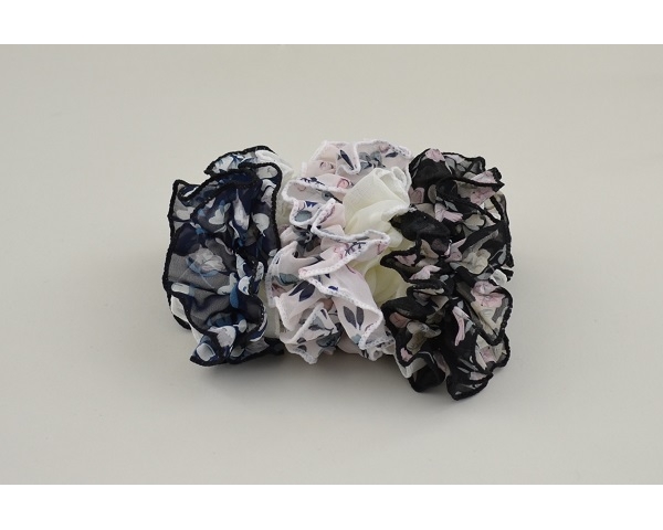 1 x Large ruffle scrunchie per card in floral design. Packed colours as per image
